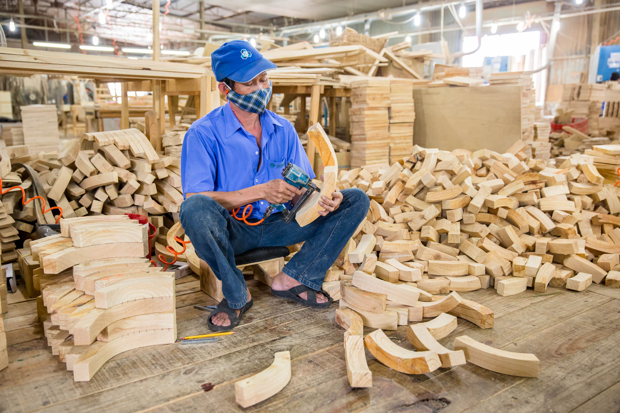 Factory Ho Chi Minh City Photographer Ehrin Macksey produces Corporate, Industrial photography for furniture Manufacture. Photography by Ehrin Macksey.