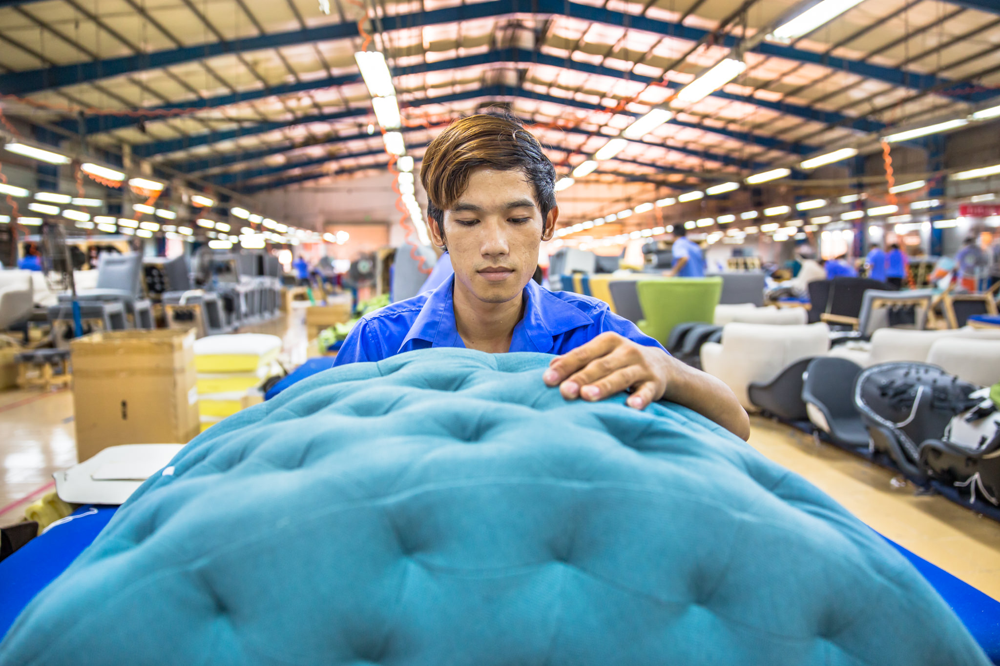 Factory Ho Chi Minh City Photographer Ehrin Macksey produces Corporate, Industrial photography for furniture Manufacture. Photography by Ehrin Macksey.