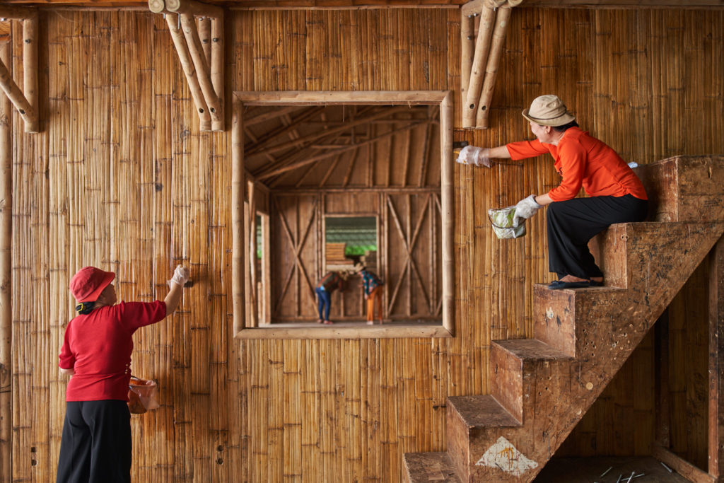 Bamboo poles and craftsmen on the production floor