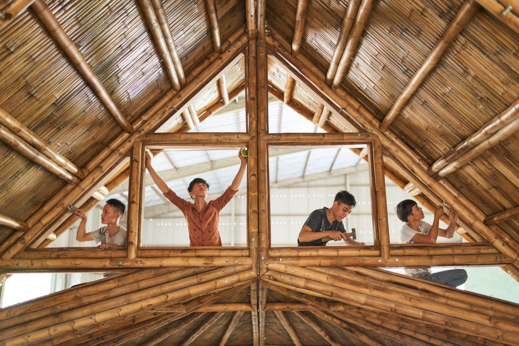 Artisans working on handmade bamboo furniture
