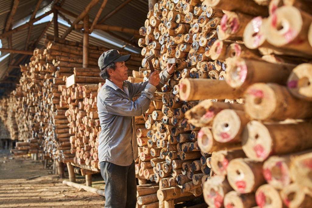 Craftsmen working on bamboo structures at the workshop